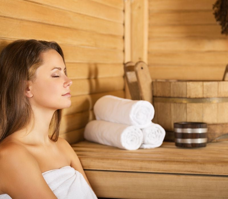 Woman with headache at Infrared Sauna