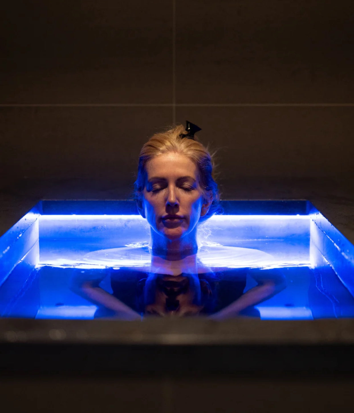 Woman in Cold Plunge Tub vs Ice