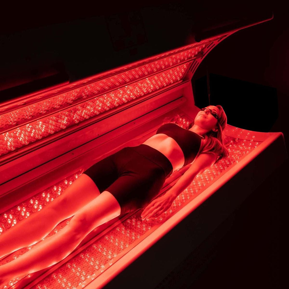 Woman inside the Red Light Therapy Bed