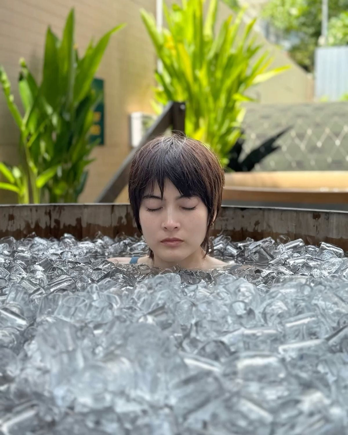 Woman in Cold Plunge Tub with Ice