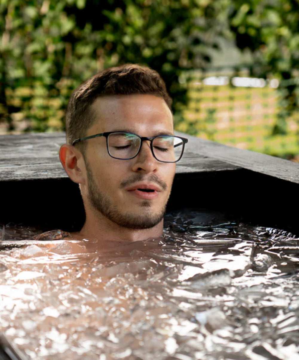 Man in cold plunge tub vs ice