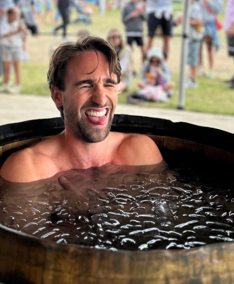 Man in Cold Plunge Tub vs Ice