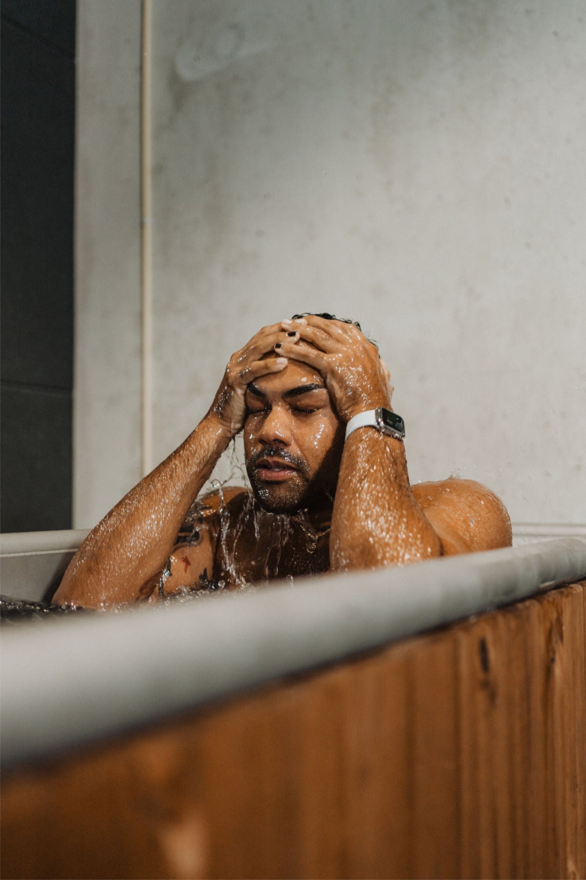 man in Cold Plunge Tub vs ice