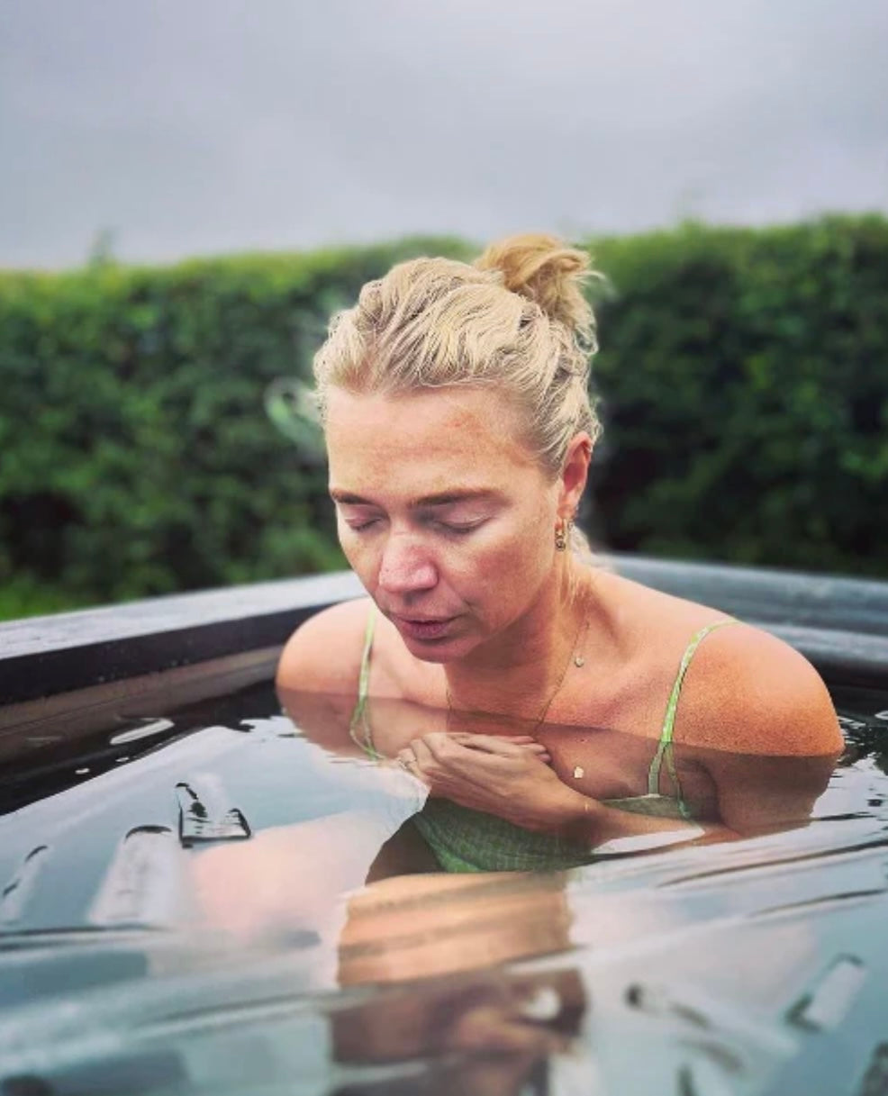 Worried Woman in Cold Plunge Tub
