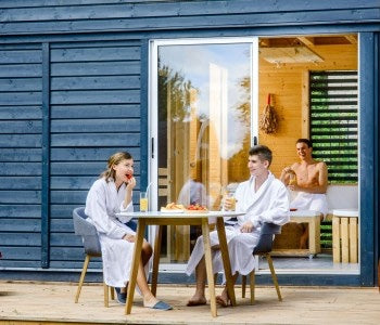 Man and Woman drinking at the Infrared Sauna Cabin