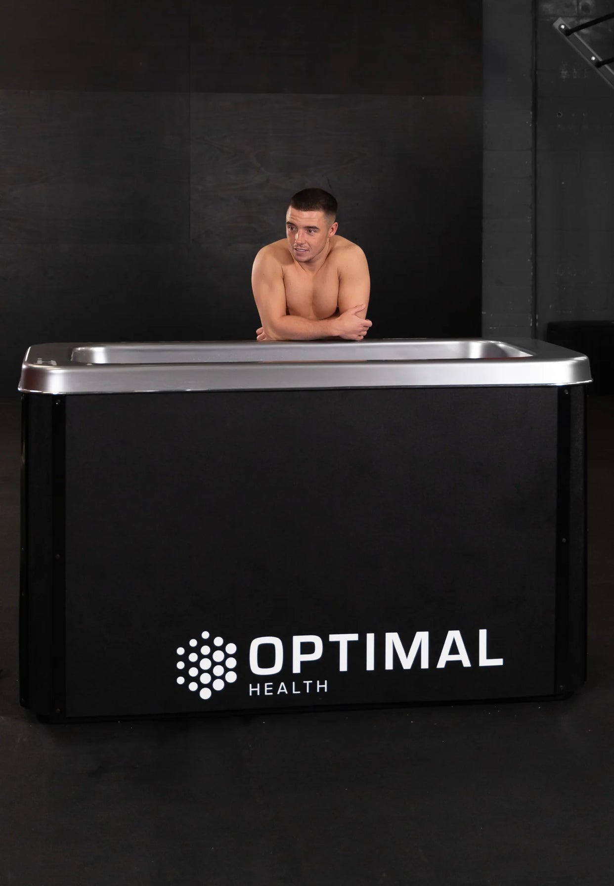 Man beside Optimal Health Plunge Tub