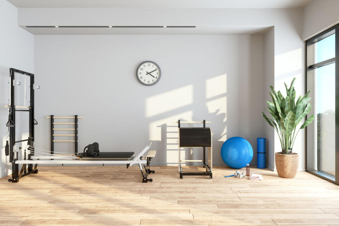 Modern Pilates studio with reformer machine, tower and equipment set up for safe and controlled training