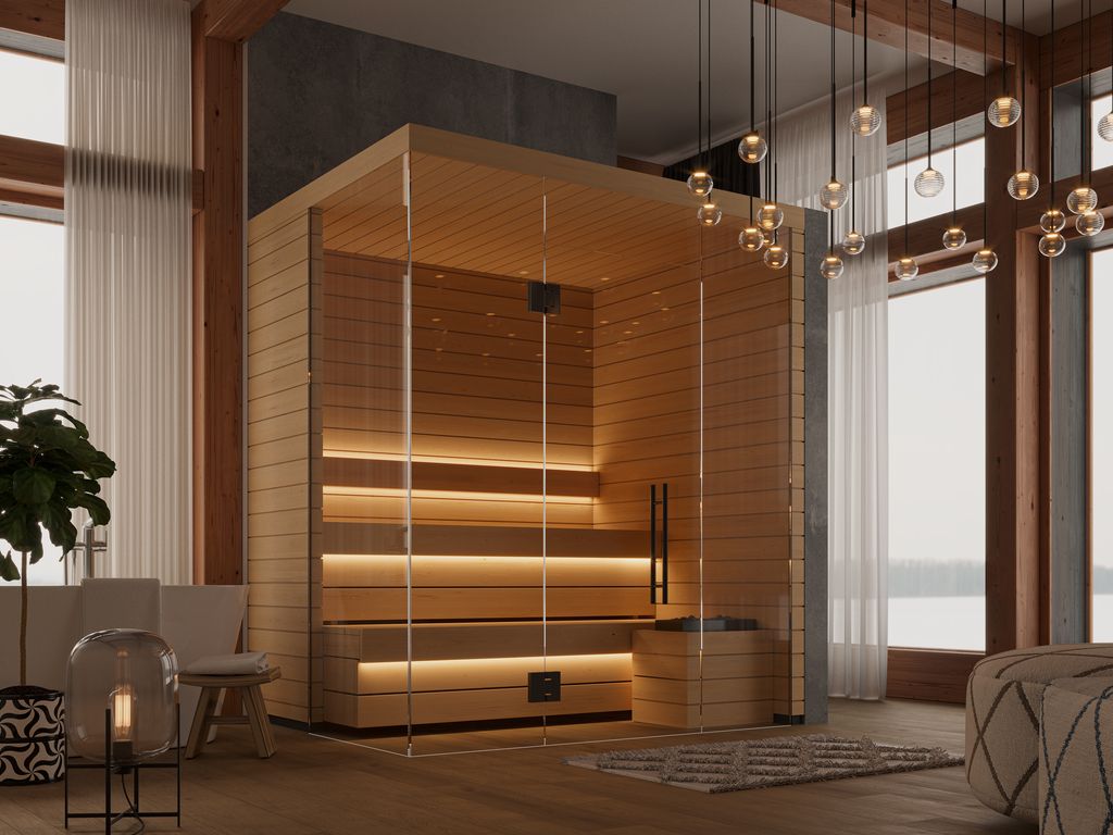 Kuut Modular Sauna Otto M with warm LED lighting and glass door, situated in a wood-accented open living space with large windows and modern pendant lights, on a luxury cabin-style background.