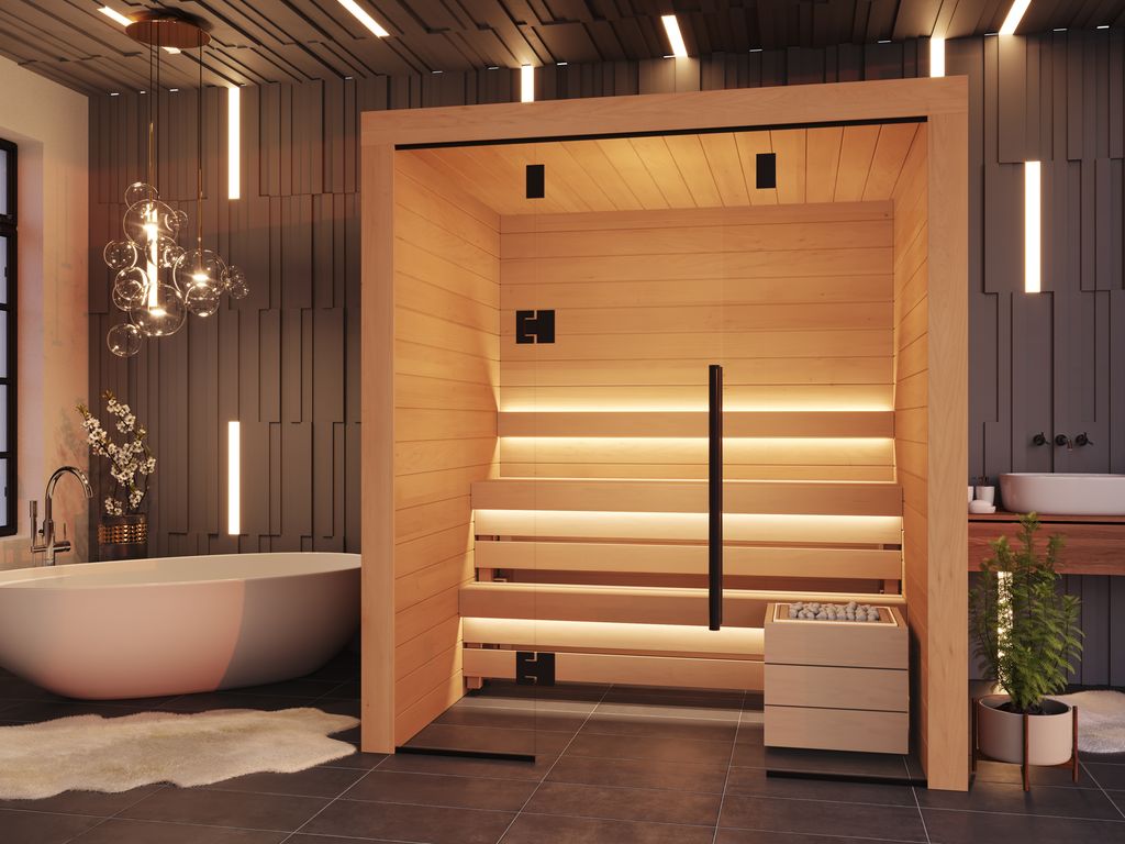 Kuut Modular Sauna Otto M with layered aspen benches and ambient strip lighting, set beside a freestanding bathtub in a high-end bathroom, on a textured dark wall background.