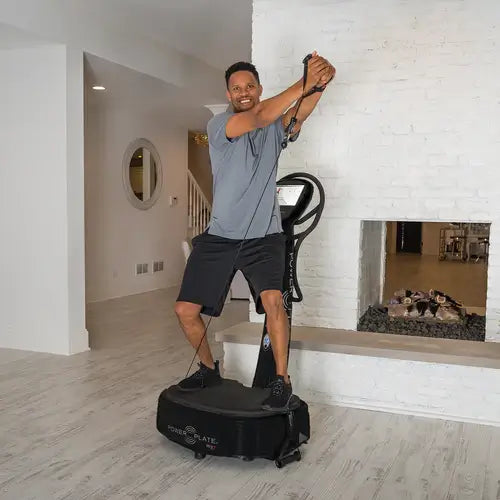 Man exercising with PowerPlate My7 at home