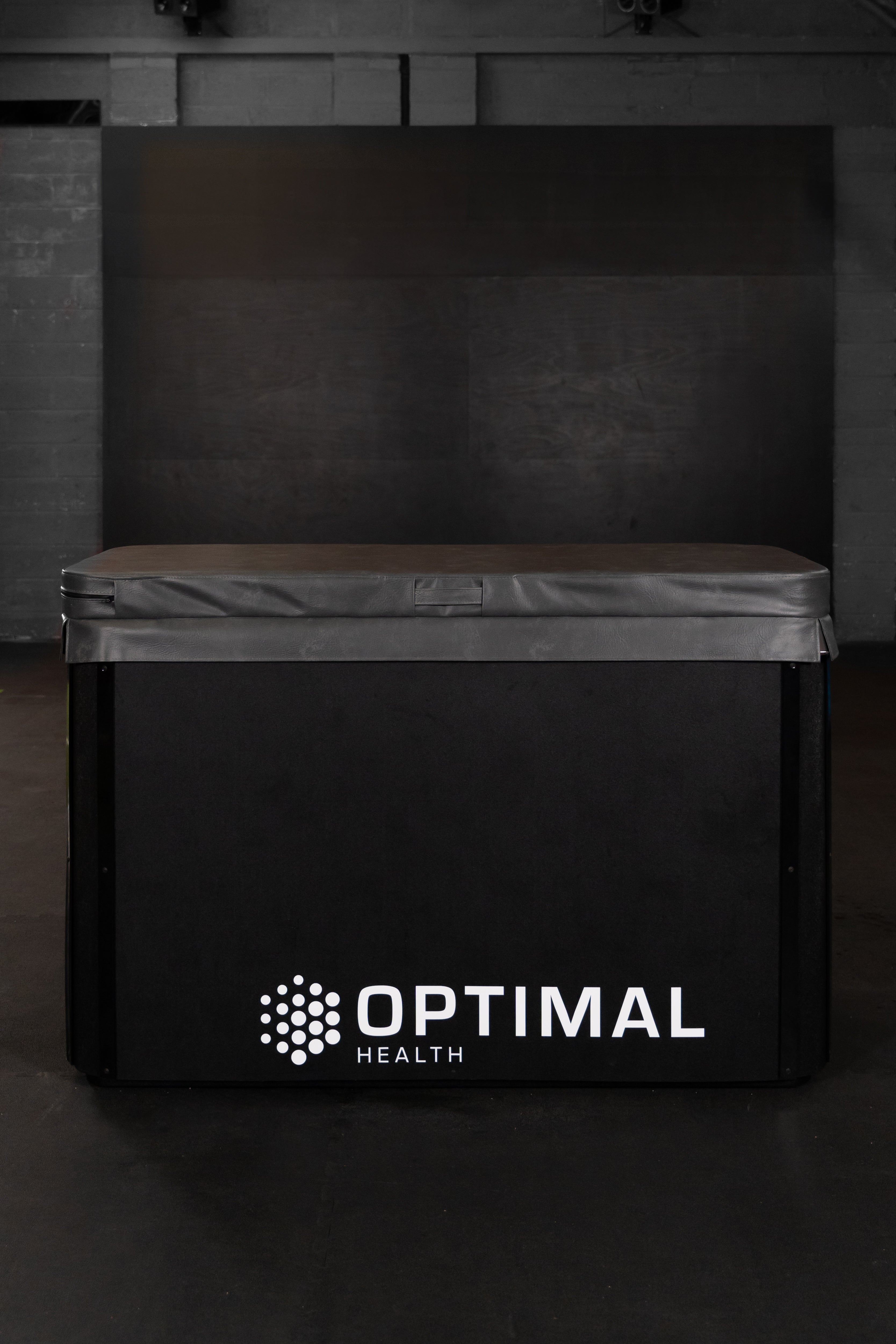 Optimal Health Ice Bath with closed insulated cover with dark background.