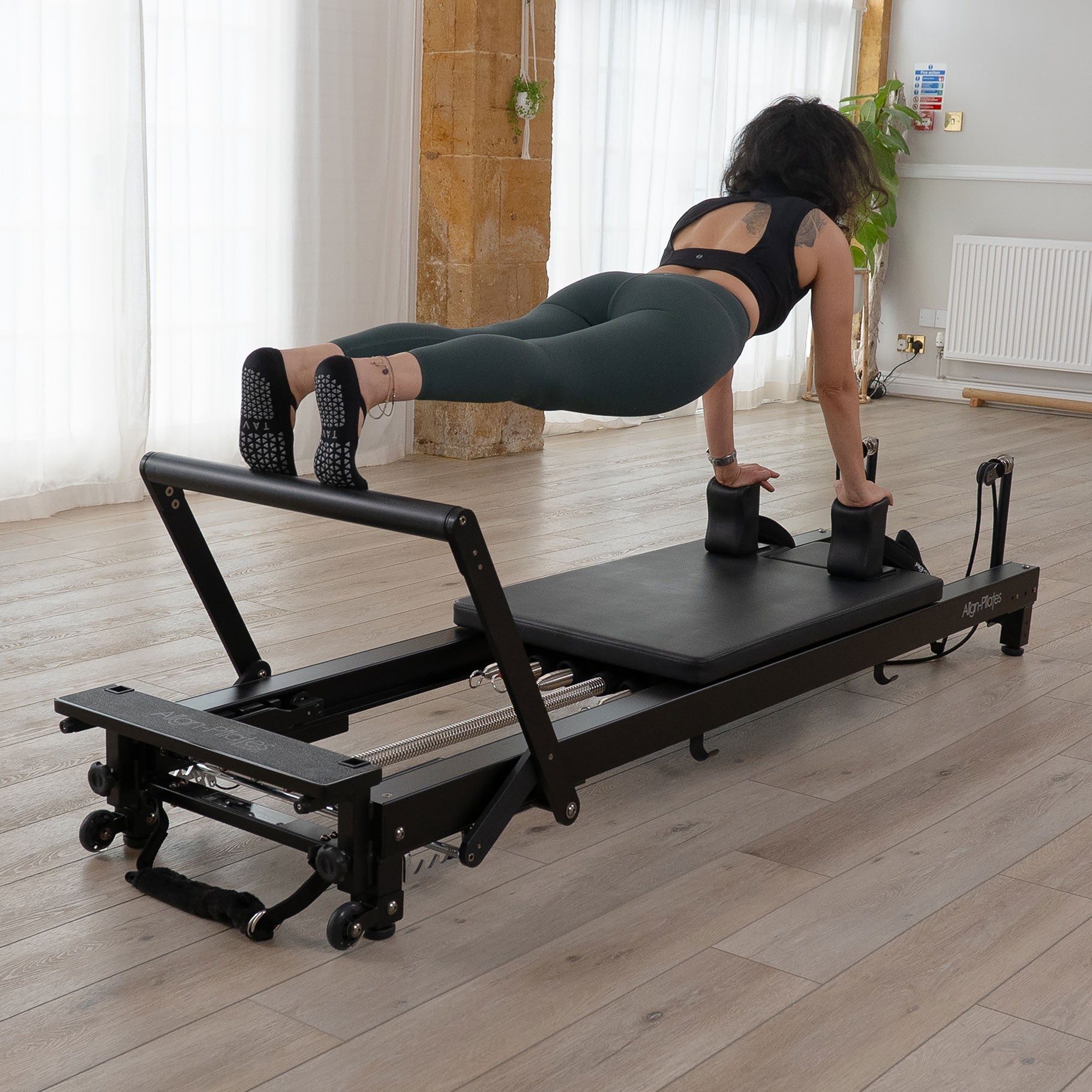 Align-Pilates C8-Pro Noir black Pilates reformer, angled product view