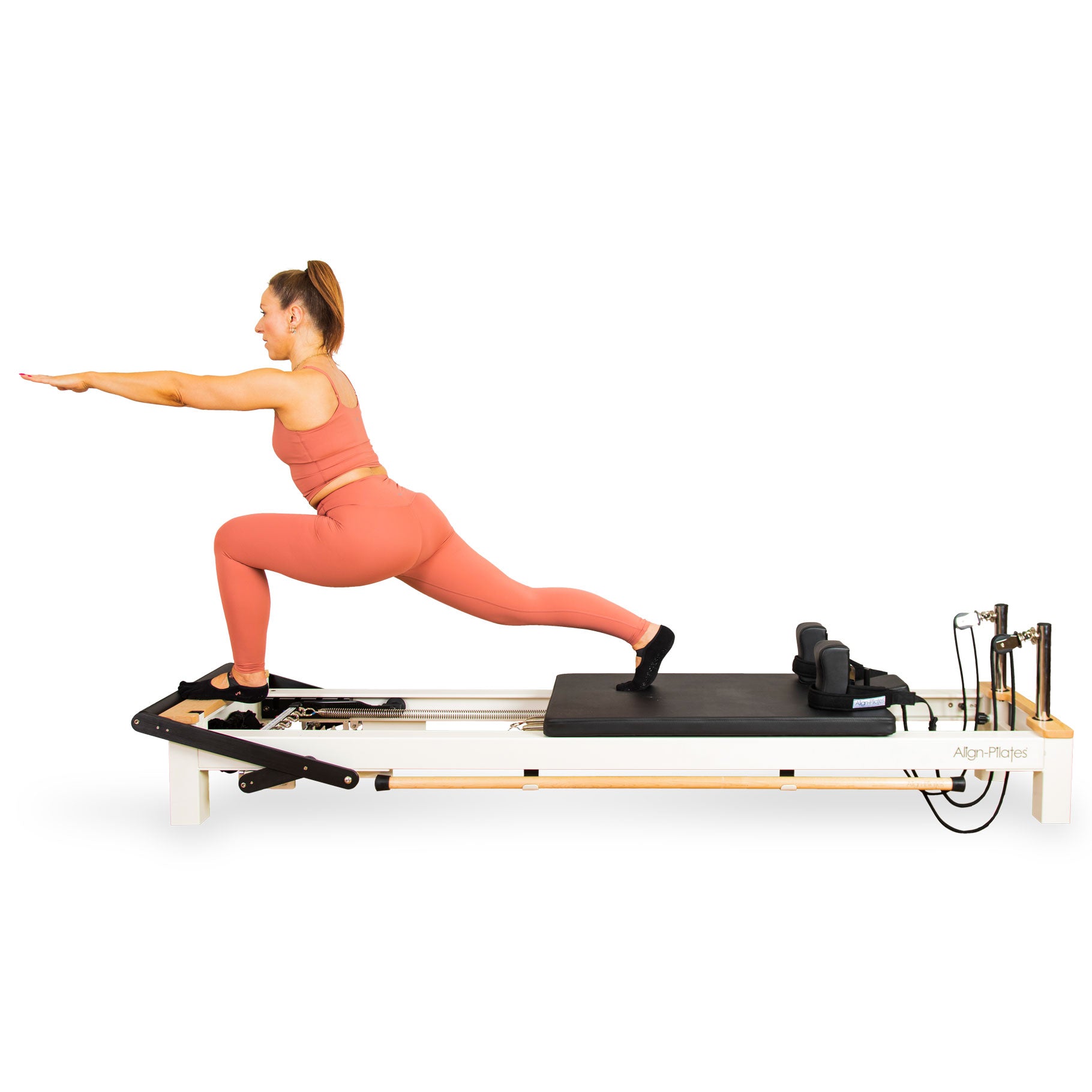 Woman using the Align-Pilates C8-S Pro Pilates reformer
