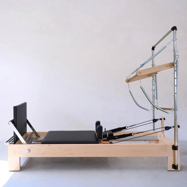 Atro Pilates Tower Reformer – black reformer machine with aluminum tower and resistance cords