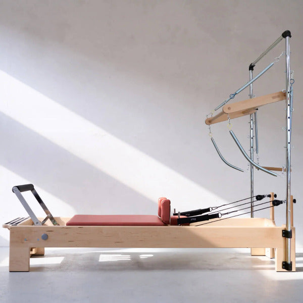 Atro Pilates Tower Reformer – pink reformer bed with adjustable tower frame and accessories