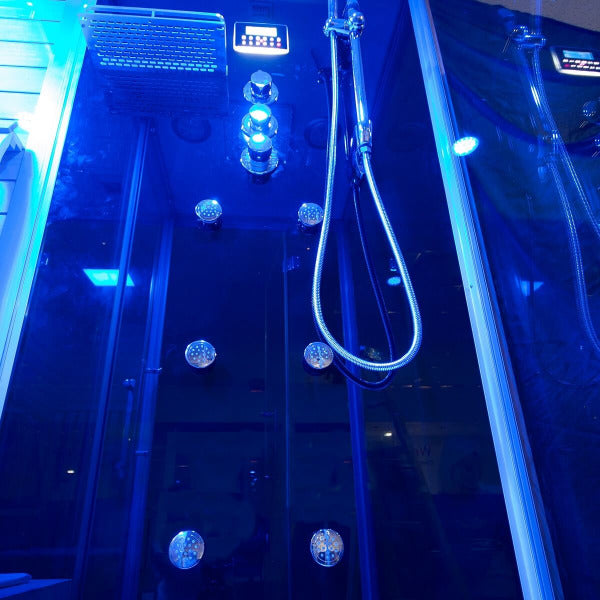 Interior of Insignia KSY1820 sauna with blue LED lighting and chrome shower fixtures