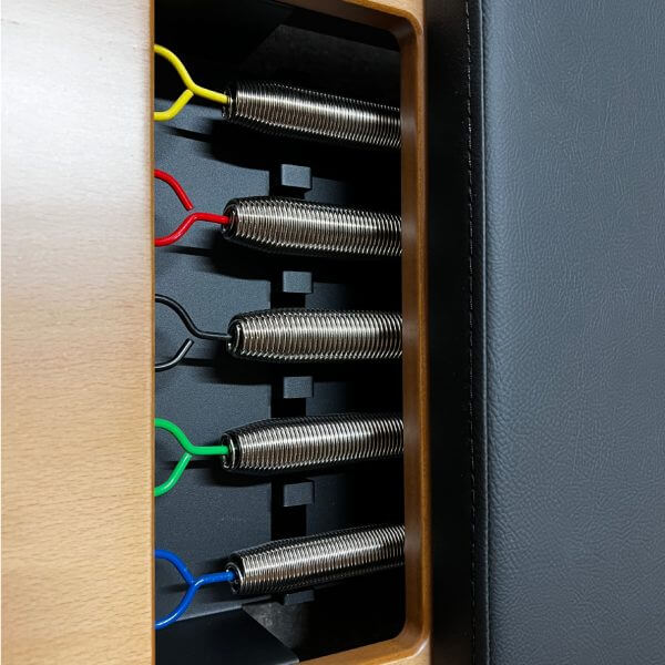 Atro Pilates Reformer Springs – close-up of colour-coded resistance springs and padded carriage