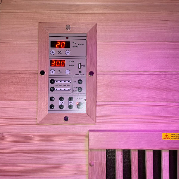 Digital control panel display inside Insignia infrared sauna with purple LED lighting
