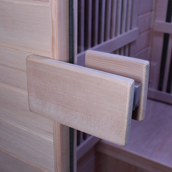 Wooden door handle detail on Insignia KY004 infrared sauna glass door