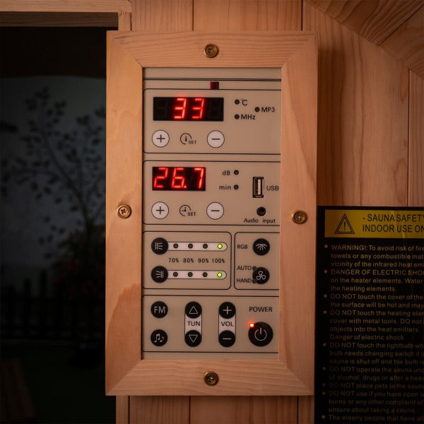 Close-up of digital sauna control panel with temperature and light settings