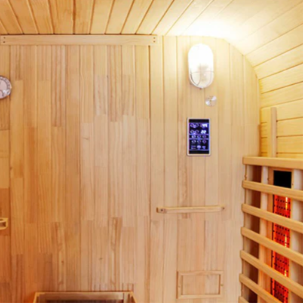 Front wall interior of the Centura Heat Outdoor Cube Sauna with thermometer, control panel, and lighting, on a curved wood background.