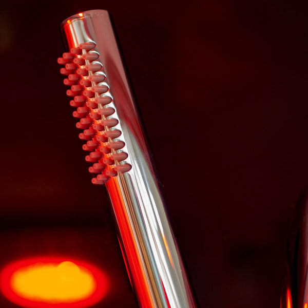 Close-up of chrome handheld shower with LED lighting in Insignia KSY1820 cabin