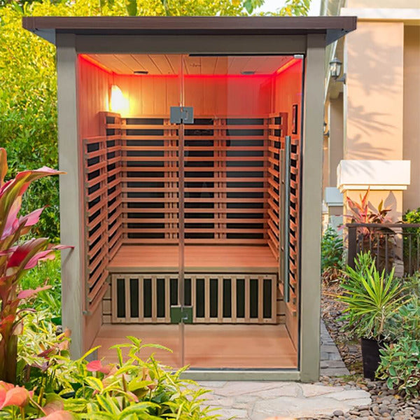 Outdoor infrared sauna with red interior lighting and glass front entry