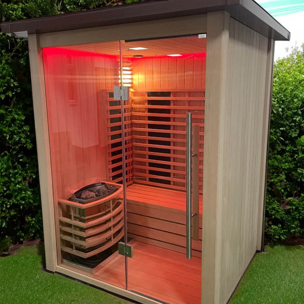 Luxury outdoor hybrid sauna with red chromatherapy lighting and glass front