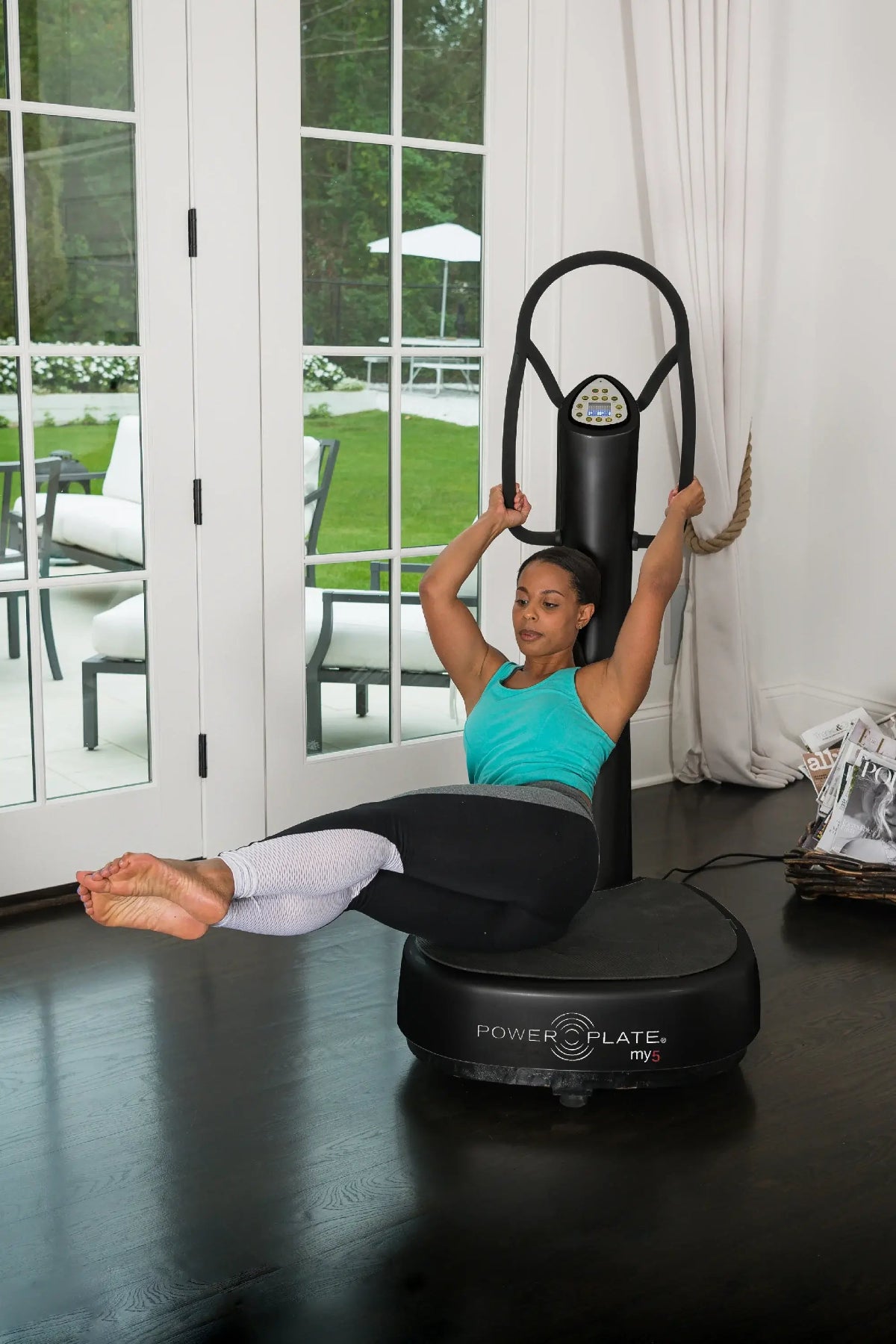 Woman exercising with MY5 inside the living room