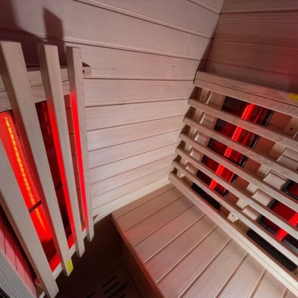 Corner view showing side and back infrared heaters of Insignia KY001 sauna