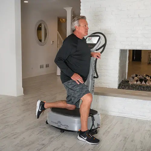 Man exercising with PowerPlate My7 at home