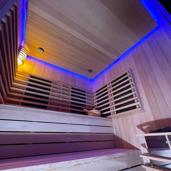Low angle view of sauna benches with blue LED chromatherapy lighting